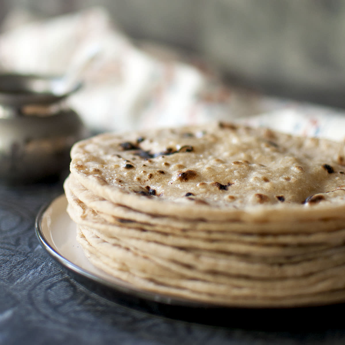 Image of Making Roti (Indian Chapati) On Roti Tawa Made Of Wheat